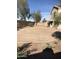 Spacious backyard featuring potential for landscaping or outdoor activities, with a covered patio at 23236 W Yavapai St, Buckeye, AZ 85326