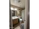 Bathroom featuring a single sink, light fixtures, and shower/tub at 23236 W Yavapai St, Buckeye, AZ 85326