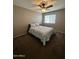 Bedroom featuring neutral walls, a ceiling fan, and a window at 23236 W Yavapai St, Buckeye, AZ 85326