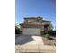 Charming two-story home with a spacious garage, well-maintained landscaping, and inviting curb appeal at 23236 W Yavapai St, Buckeye, AZ 85326