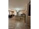 Well-lit kitchen with stainless appliances, a central island, and easy access to dining and living areas at 23236 W Yavapai St, Buckeye, AZ 85326