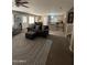 Comfortable living room showcasing an open layout with views into the kitchen and breakfast nook at 23236 W Yavapai St, Buckeye, AZ 85326