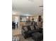 Cozy living room area featuring an open floor plan, seamlessly connected to the kitchen and dining area at 23236 W Yavapai St, Buckeye, AZ 85326