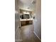 Bright main bathroom with double sinks, tile flooring, and ample counter space at 23236 W Yavapai St, Buckeye, AZ 85326