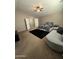 Spacious main bedroom with neutral tones, plush carpeting, and a large closet, creating a serene retreat at 23236 W Yavapai St, Buckeye, AZ 85326