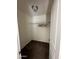 Compact walk-in closet with carpet and wire shelving at 23236 W Yavapai St, Buckeye, AZ 85326