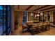 Well lit dining room with a wooden table and large windows providing ample light at 4849 N Camelback Ridge Rd # A309, Scottsdale, AZ 85251