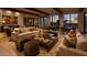Warm living room with wooden beams, comfortable seating and natural light at 4849 N Camelback Ridge Rd # A309, Scottsdale, AZ 85251