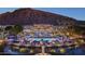 Luxury resort with pools, palm trees, and mountain views in the background at 4849 N Camelback Ridge Rd # A309, Scottsdale, AZ 85251