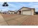 Single-story home with a spacious driveway and a two-car garage at 8007 W Corrine Dr, Peoria, AZ 85381