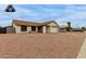 Well-maintained single-story home with a desert landscape and two-car garage at 8007 W Corrine Dr, Peoria, AZ 85381