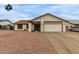 Charming single-story home featuring a low-maintenance yard and attached two-car garage at 8007 W Corrine Dr, Peoria, AZ 85381