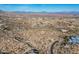 Desert community aerial view showcases luxury homes amidst the natural desert landscape with mountain backdrop at 11130 E Rolling Rock Dr, Scottsdale, AZ 85262