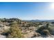 View of desert community showcasing natural desert vegetation and mountain views at 11130 E Rolling Rock Dr, Scottsdale, AZ 85262