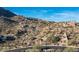 Homes nestled amongst the desert landscape, blending luxury living with natural surroundings in a vibrant desert community at 11130 E Rolling Rock Dr, Scottsdale, AZ 85262