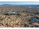 Aerial view of the community and surrounding desert landscape, showcasing community layout and city views at 11130 E Rolling Rock Dr, Scottsdale, AZ 85262