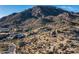 Scenic desert view with native vegetation, winding road, and surrounding homes blended into the landscape at 11130 E Rolling Rock Dr, Scottsdale, AZ 85262