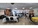 Wide view of banquet hall with tables and chairs, with a fireplace in the background at 120 N Val Vista Dr # 230, Mesa, AZ 85213