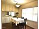 Bright dining room with a classic table setting, showcasing built-in storage and ample natural light at 120 N Val Vista Dr # 230, Mesa, AZ 85213
