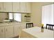 Elegant dining area featuring built-in cabinets, a mirrored wall, and a view of the well-lit space at 120 N Val Vista Dr # 230, Mesa, AZ 85213