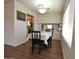 Cozy dining space with a charming table setting, enhanced by natural light and a view into the kitchen at 120 N Val Vista Dr # 230, Mesa, AZ 85213