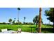 Relaxing outdoor patio with wrought iron fencing and views of the lush, green golf course at 120 N Val Vista Dr # 230, Mesa, AZ 85213