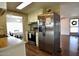 Kitchen featuring modern appliances, wood floors, and ample counter space at 120 N Val Vista Dr # 230, Mesa, AZ 85213