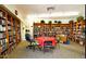 Community library with well-stocked bookshelves, a cozy table and chairs for reading at 120 N Val Vista Dr # 230, Mesa, AZ 85213
