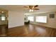 Spacious living room with hardwood floors seamlessly flowing into the dining area, creating an open feel at 120 N Val Vista Dr # 230, Mesa, AZ 85213