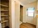 Well-organized pantry area with shelving and a door leading to the outside at 120 N Val Vista Dr # 230, Mesa, AZ 85213