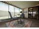 Relax on this enclosed patio featuring a rug, seating, and decor at 120 N Val Vista Dr # 230, Mesa, AZ 85213