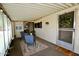 Enclosed patio with small table, two chairs, a rug and decor at 120 N Val Vista Dr # 230, Mesa, AZ 85213