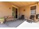 Back patio featuring hanging lights, an exterior ceiling fan, and an outdoor bench and seating area at 12033 W Davis Ln, Avondale, AZ 85323