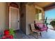 Cozy front porch with a decorative bench and greenery that creates a welcoming entryway at 12033 W Davis Ln, Avondale, AZ 85323