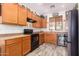 Well-equipped kitchen with modern appliances, ample cabinet space, and a built-in wine cooler at 12033 W Davis Ln, Avondale, AZ 85323