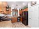 Functional kitchen featuring updated appliances, generous counter space, and a convenient wine fridge at 12033 W Davis Ln, Avondale, AZ 85323