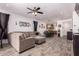 Open floor plan showcases a spacious living room seamlessly connected to the kitchen and dining area at 12033 W Davis Ln, Avondale, AZ 85323