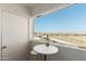 Cozy balcony with a table and seating offers a great view at 12123 W Bell Rd # 339, Surprise, AZ 85378