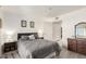 Cozy bedroom with a large bed, wood-look floors, and closet for ample storage space at 12123 W Bell Rd # 339, Surprise, AZ 85378