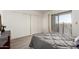 Bedroom with sliding glass doors lead to a balcony and large wardrobe at 12123 W Bell Rd # 339, Surprise, AZ 85378