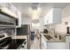 Updated kitchen with granite countertops, stainless steel appliances, and neutral tile backsplash at 12123 W Bell Rd # 339, Surprise, AZ 85378