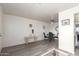 Open-concept living space showing dining area and living room with luxury vinyl plank flooring at 12123 W Bell Rd # 339, Surprise, AZ 85378