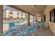 Community pool with seating, covered patio area and lush landscaping at 12123 W Bell Rd # 339, Surprise, AZ 85378