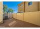 Fenced backyard with gravel landscaping and a view of the exterior of the home at 1367 S Country Club Dr # 1276, Mesa, AZ 85210