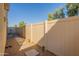 View of a gravel backyard with walkway and tall privacy fence at 1367 S Country Club Dr # 1276, Mesa, AZ 85210