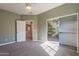 Cozy bedroom features a closet with a mural, soft carpet and views of the upstairs hallway at 1367 S Country Club Dr # 1276, Mesa, AZ 85210