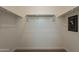 Walk-in closet featuring shelving, railing, and a wall safe at 1367 S Country Club Dr # 1276, Mesa, AZ 85210