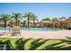 Relax in the community pool area with comfortable seating and resort style fountains at 1367 S Country Club Dr # 1276, Mesa, AZ 85210