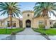 Exterior view of a community building with palm trees and desert landscaping at 1367 S Country Club Dr # 1276, Mesa, AZ 85210