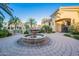 A stunning front entrance featuring manicured landscaping and circular fountain at 1367 S Country Club Dr # 1276, Mesa, AZ 85210